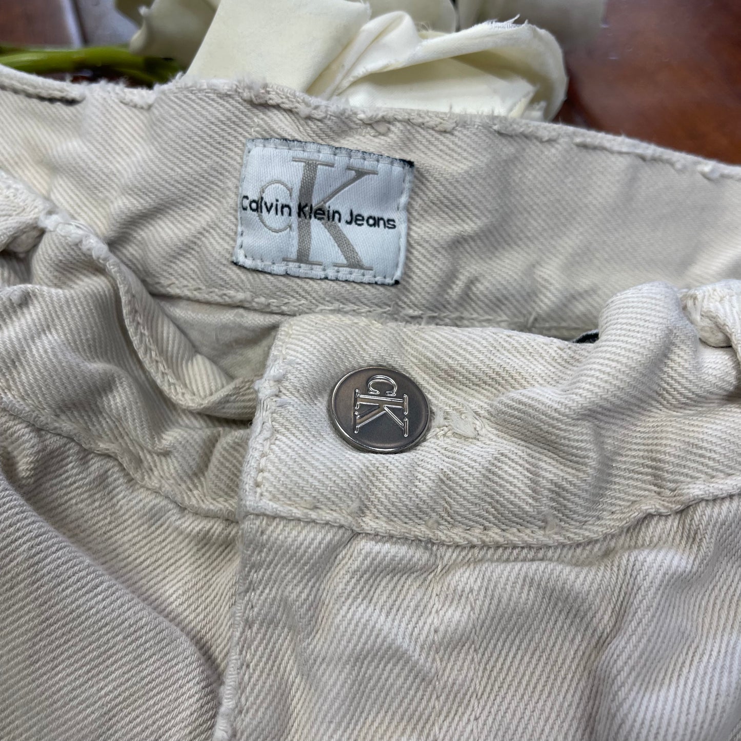 THRIFTED CALVIN KLEIN BEIGE CUT-UP JEAN SHORTS